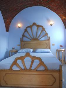 מיטה או מיטות בחדר ב-Villa Diletta Luxor
