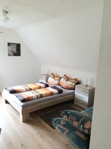 a room with two beds with pillows on them at Ferienwohnung am Fackelstein in Eiserfey