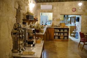 a kitchen with a counter and aasteryasteryasteryasteryasteryasteryasteryasteryastery at Taru Cave Suites in Urgup