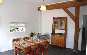 a dining room with a wooden table and chairs at Cozy Home In De Meern With Wifi in Utrecht