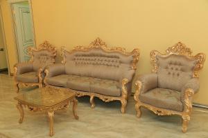three chairs and a coffee table in a room at AL SHEIKH 5 BEDROOM LUXURY APARTMENT 1 in Yerevan