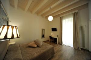B&B Palazzo San Michele tesisinde bir odada yatak veya yataklar