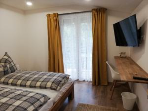Postel nebo postele na pokoji v ubytování Gästezimmer Klopfer