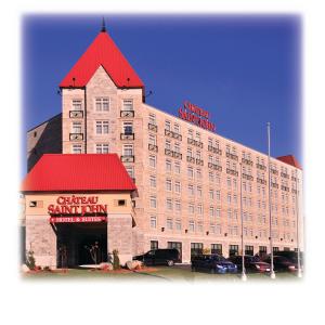 a large building with a red roof on top of it at Chateau Saint John Trademark Collection by Wyndham in Saint John