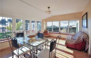 a living room with a glass table and chairs at Gorgeous Home In Cabris With Wifi in Cabris