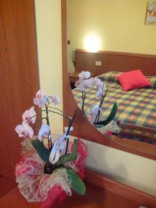 Postel nebo postele na pokoji v ubytování Hotel Monte Fior