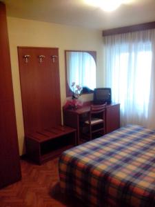 Postel nebo postele na pokoji v ubytování Hotel Monte Fior