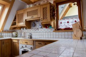 Kuchyňa alebo kuchynka v ubytovaní Giewont Lux - Sauna i Basen