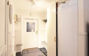 a hallway with a door leading into a room at Cozy Home In Sysslebäck With Kitchen in Branäs
