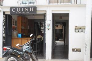 a motorcycle parked in front of a store at Hospedaje Donaji in Oaxaca City