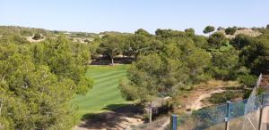 - une vue sur un parcours de golf arboré dans l'établissement Villa Trevali wonderful views STUNNING PRIVATE POOL heated free oct till may, à Villacosta