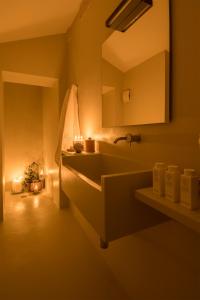 a bathroom with a sink and a mirror at Dimora Talenti in Polignano a Mare
