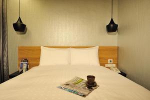 Letto o letti in una camera di Forward Suites II