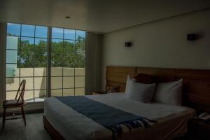 Postel nebo postele na pokoji v ubytování Hotel Plaza Kokai Cancún