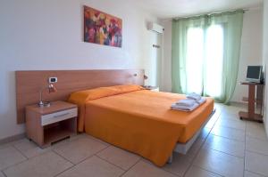 A bed or beds in a room at Giardino Dei Suoni B&B