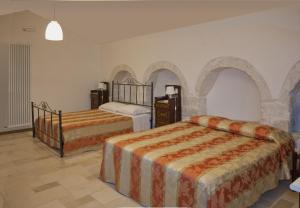 Katil atau katil-katil dalam bilik di Grotta Cilicia B&B