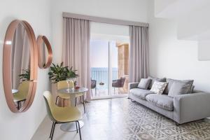 a living room with a couch and a table at Dimora Talenti in Polignano a Mare
