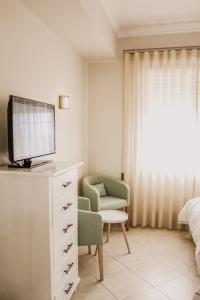 TV a/nebo společenská místnost v ubytování Hotel Neptuno