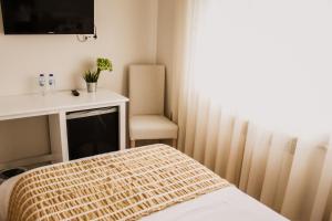 Postel nebo postele na pokoji v ubytování Hotel Neptuno