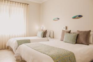 Postel nebo postele na pokoji v ubytování Hotel Neptuno