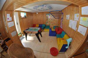 a childs room with a play room with a play table at Apparthotel Bliem in Schladming