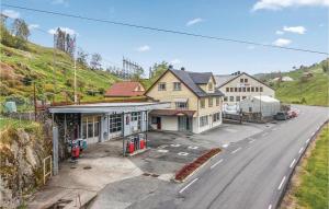 an aerial view of a street with houses and a road at 5 Bedroom Lovely Home In Seim in Seim