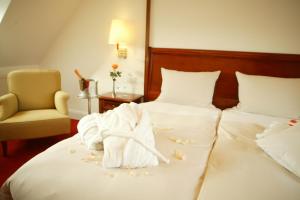 Postel nebo postele na pokoji v ubytování Hotel Moosburger Hof