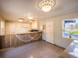 a kitchen with hammocks in the middle of a room at Beach House Inn in Fort Bragg