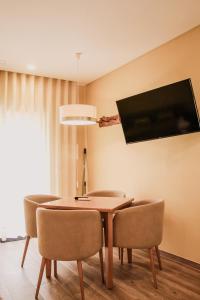TV a/nebo společenská místnost v ubytování Hotel Neptuno