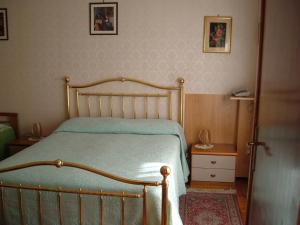 Postel nebo postele na pokoji v ubytování Albergo Luca