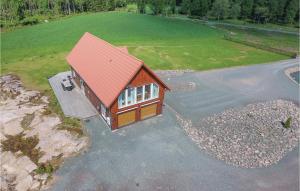an overhead view of a house with a red roof at Beautiful Home In Aneby With Wifi in Aneby