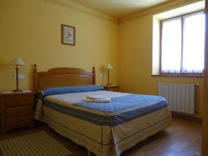 Posteľ alebo postele v izbe v ubytovaní Apartaments La Llucana