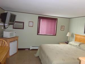 Postel nebo postele na pokoji v ubytování Happy Motel
