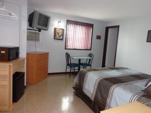 Postel nebo postele na pokoji v ubytování Happy Motel