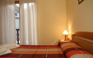 Posteľ alebo postele v izbe v ubytovaní Apartaments La Llucana