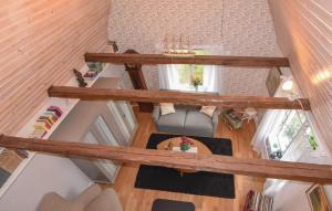 an overhead view of a living room with wooden beams at 1 Bedroom Pet Friendly Home In Larv in Larv