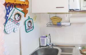 a kitchen with a sink and a counter top at Holiday Home Harzgerode Ot Neudorf Lxxiii in Neudorf +6 photos