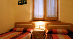 Posteľ alebo postele v izbe v ubytovaní Apartaments La Llucana