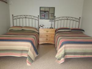 Postel nebo postele na pokoji v ubytování Happy Motel