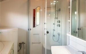 a bathroom with a shower and a sink at 3 Bedroom Stunning Home In Farsund in Farsund