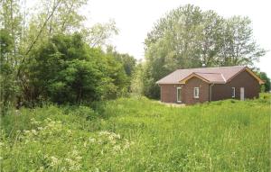 a small house in the middle of a field at Stunning Home In Boiensdorf With Sauna in Boiensdorf