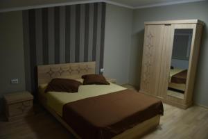 Postel nebo postele na pokoji v ubytování gogoli family hotel