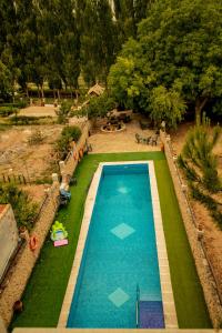 an overhead view of a swimming pool in a garden at Apartamentos Rurales Labrador in Arbuniel
