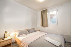 Postel nebo postele na pokoji v ubytování Apartments Marko