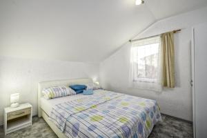 Postel nebo postele na pokoji v ubytování Apartments Marko