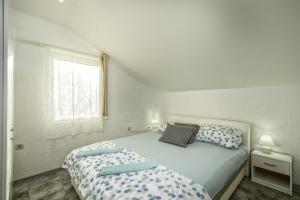 Postel nebo postele na pokoji v ubytování Apartments Marko
