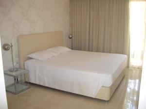 Voodi või voodid majutusasutuse Crystal Hotel toas