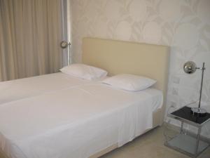 Voodi või voodid majutusasutuse Crystal Hotel toas