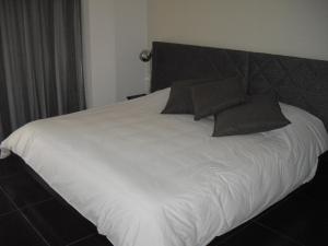 Voodi või voodid majutusasutuse Crystal Hotel toas