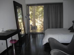 Voodi või voodid majutusasutuse Crystal Hotel toas